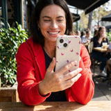 Seashell Lil Flutters iPhone 14 Case - Lifestyle photo showing phone case in use