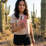 Bubblegum Pink Flora iPhone 15 Pro Case - Lifestyle photo showing phone case in use