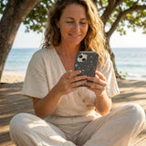 Black Galactic Glow iPhone 14 Case - Lifestyle photo showing phone case in use