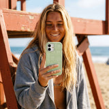 Sage Green Green Cascade iPhone 15 Case - Lifestyle photo showing phone case in use