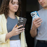 Black Galactic Glow iPhone 14 Pro Max Case - Lifestyle photo showing phone case in use