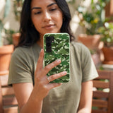 Sage Green Dino Camo Samsung Galaxy S25 Case - Lifestyle photo showing phone case in use