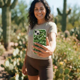 Sage Green Dino Camo iPhone 14 Case - Lifestyle photo showing phone case in use