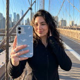 Powder Blue Lil Dinos iPhone 15 Pro Case - Lifestyle photo showing phone case in use