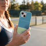 Sage Green Tennis Court iPhone 15 Case - Lifestyle photo showing phone case in use