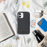 Black Hexclad iPhone 15 Case - Lifestyle photo showing phone case in use