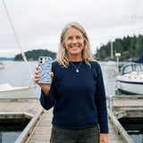 Powder Blue Fishery iPhone 15 Case - Lifestyle photo showing phone case in use