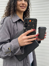 Black Galactic Glow Samsung Galaxy S24+(Plus) Case - Lifestyle photo showing phone case in use