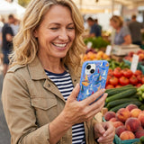 Electric Blue Dockside Dreams iPhone 14 Case - Lifestyle photo showing phone case in use