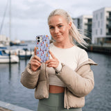 Powder Blue Sails and Seagulls iPhone 15 Case - Lifestyle photo showing phone case in use