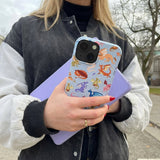 Powder Blue Dragon Cuties iPhone 13 Case - Lifestyle photo showing phone case in use