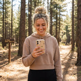 Seashell Lil Dragons iPhone 15 Pro Case - Lifestyle photo showing phone case in use