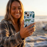 Powder Blue Tropical Rainforest iPhone 14 Case - Lifestyle photo showing phone case in use