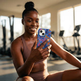 Electric Blue Jungle Cat iPhone 15 Pro Case - Lifestyle photo showing phone case in use