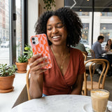 Bubblegum Pink Purr iPhone 15 Case - Lifestyle photo showing phone case in use