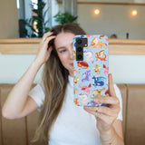 Powder Blue Dragon Cuties Samsung Galaxy S24 Case - Lifestyle photo showing phone case in use