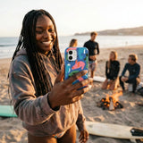 Electric Blue Sea Cows iPhone 14 Case - Lifestyle photo showing phone case in use