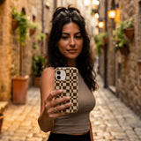 London Fog Chestnut Checkers iPhone 16 Pro Case - Lifestyle photo showing phone case in use