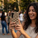 London Fog Chestnut Checkers Samsung Galaxy S25 Case - Lifestyle photo showing phone case in use