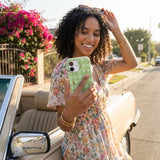 Sage Green Fall Gingham iPhone 15 Case - Lifestyle photo showing phone case in use