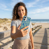 Electric Blue Dizzy Dreams iPhone 16 Pro Case - Lifestyle photo showing phone case in use