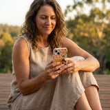 Seashell Fall Flourish iPhone 14 Case - Lifestyle photo showing phone case in use