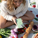 Sage Green Linear Entomology iPhone 15 Pro Case - Lifestyle photo showing phone case in use