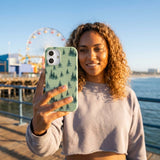 Sage Green Pine Season iPhone 16 Case - Lifestyle photo showing phone case in use