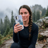 Powder Blue Shredding Peaks iPhone 16 Pro Case - Lifestyle photo showing phone case in use