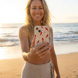 Seashell Cardinals iPhone 14 Case - Lifestyle photo showing phone case in use