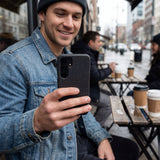Black Samsung S25 Phone Case - Lifestyle photo showing phone case in use