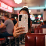 Seashell Lucky You Samsung Galaxy S25 Case - Lifestyle photo showing phone case in use