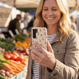 Seashell Tulip Bliss Samsung Galaxy S25 Case - Lifestyle photo showing phone case in use