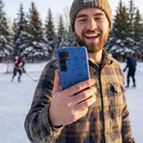 Electric Blue Hockey Postage Samsung Galaxy S25 Case - Lifestyle photo showing phone case in use