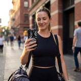 Black Snake Scale Samsung Galaxy S25 Case - Lifestyle photo showing phone case in use