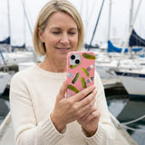 Bubblegum Pink Pickle Party iPhone 14 Case - Lifestyle photo showing phone case in use