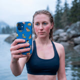 Electric Blue Fancy Frogs iPhone 16 Pro Max Case - Lifestyle photo showing phone case in use