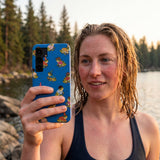 Electric Blue Fancy Frogs Samsung Galaxy S25 Case - Lifestyle photo showing phone case in use