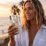 London Fog Sea Gems iPhone 15 Case - Lifestyle photo showing phone case in use