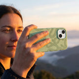 Sage Green Snaky iPhone 17 Pro Case - Lifestyle photo showing phone case in use
