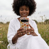 Seashell Shrooms and Blooms Google Pixel 10/10 Pro Case - Lifestyle photo showing phone case in use