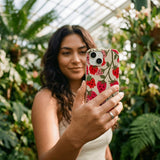 Seashell Strawboories iPhone 16 Case - Lifestyle photo showing phone case in use