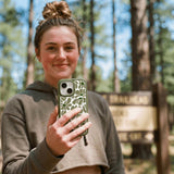 Clear Funky Flora iPhone 17 Case With Forest Floor Ridge (MagSafe included) - Lifestyle photo showing phone case in use