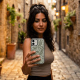 Clear Fern Dreams iPhone 17 Case With Noir Ridge (MagSafe included) - Lifestyle photo showing phone case in use
