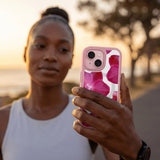 Clear Pink Orchids iPhone 17 Pro Case With Petal Pink Ridge (MagSafe included) - Lifestyle photo showing phone case in use