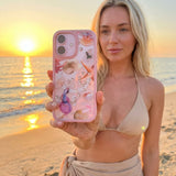 Clear Aqua Dreams iPhone 17 Pro Case With Petal Pink Ridge (MagSafe included) - Lifestyle photo showing phone case in use