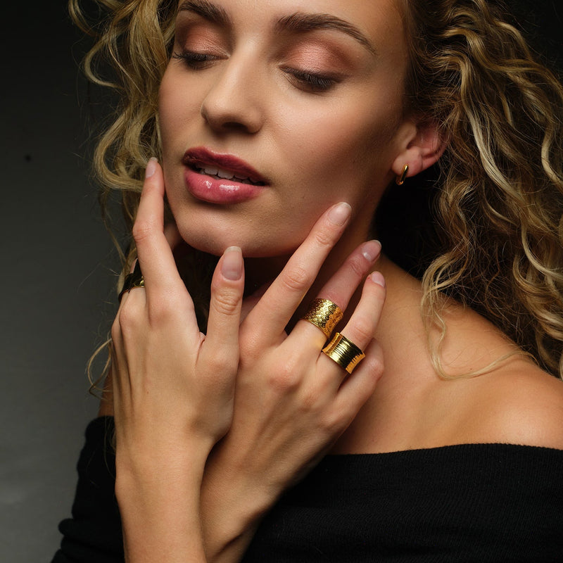 Our Nudo collection is an emblem of the modern jewellery that is a second skin to every woman. This fully size adjustable sustainable ring is hand-sculpted to define your daily look with an organic embossed surface with tiny gold dots. The ring can be worn on any part of the finger.
