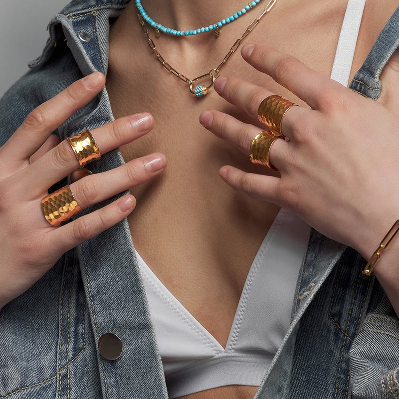 Our Nudo collection is a representation of the modern jewellery that is a second skin to every woman. This size adjustable sustainable gold ring is hand-sculpted to define your daily look with an organic embossed surface. 