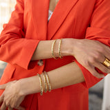 The Otto Twiste Gold Bangle  can simply be worn with a white t-shirt or used to bring a little bit of glam to an evening dress. Delicately handmade to fit any wrist size, the Otto bangles are the perfect finishing touch whether you’re stacking them together or wearing one that holds a special meaning.