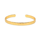 The Otto Hammered Gold Bangle is the ultimate sustainable cuff bracelet. Its gently hammered surface catches the light, creating a nuanced surface that's perfectly imperfect. Made to be stacked, yet delicate enough to wear alone.